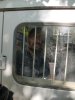 Андрей Рудомаха за решеткой милицейской машины