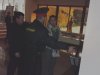 Милиционер и Лисицкий безуспешно пытаются выдворить Газаряна обратно за заграждения