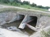 Очищенный после наводнения работниками ООО "ЧПТК" водосбросной канал