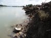 Строительный мусор вместе с землей размывается течение реки Кубань