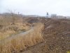 Краснодар. Незаконная отсыпка территории рекреационной зоны возле авторынка подступила вплотную к ручью