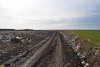 Свежий мусор с "рекультивированной" Успенской свалки разносится по окрестным полям 