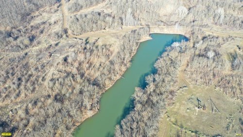 Пруд 3-я плотина в районе п.Октябрьский на фоне зимнего леса
